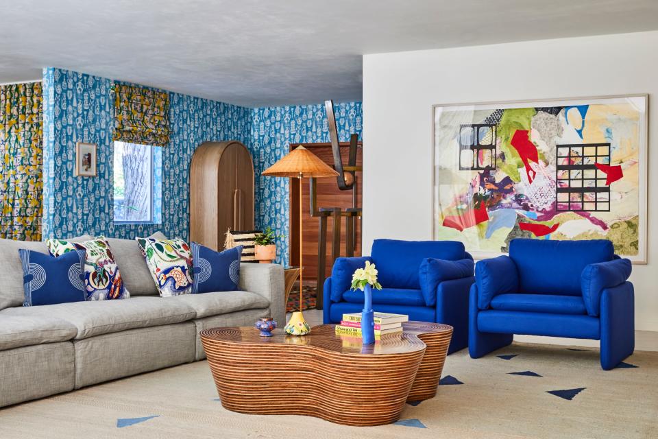 A bit of nostalgia slips into the picture thanks to an art piece done by the homeowner’s grandmother, Joan Lehman. The much-sought-after RH Cloud sofa in a gray linen compliments two Anthropologie side chairs covered in an Yves Klein blue fabric. Laying neatly beneath an Oggetti Orgo coffee table is one of the rugs Bunsa had custom-made in Marrakesh during one of her trips to Morocco.