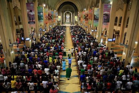 Filipino Catholic devotees attend a regular mass at a National Shrine of Our Mother of Perpetual Help in Baclaran, Paranaque city, metro Manila, Philippines September 18, 2016. REUTERS/Romeo Ranoco/File Photo