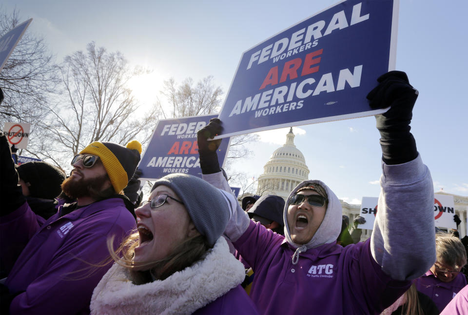 On the 20th day of a partial government shutdown, federal employees rally at the Capitol to protest the impasse between Congress and President Donald Trump over his demand to fund a U.S.-Mexico border wall, in Washington, Thursday, Jan. 10, 2019. (AP Photo/J. Scott Applewhite)