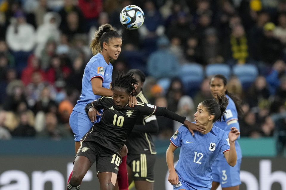 France's Maelle Lakrar, left, Jamaica's Jody Brown and France's Clara Mateo battle for the ball during the Women's World Cup Group F soccer match between France and Jamaica at the Sydney Football Stadium in Sydney, Australia, Sunday, July 23, 2023. (AP Photo/Mark Baker)