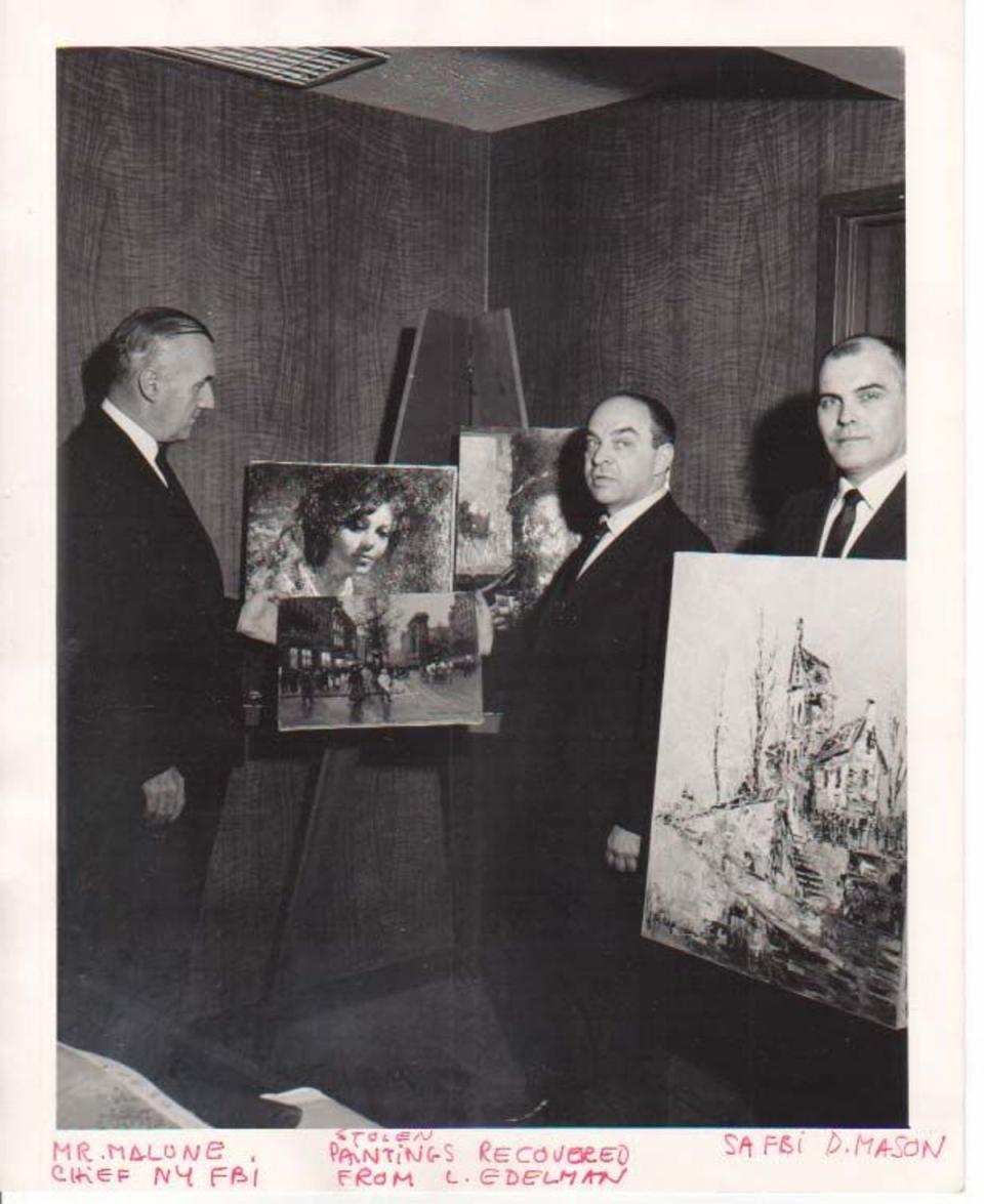 Chief of New York’s FBI division assessing stolen paintings by Mr Edelman (Courtesy of Art Recovery International)
