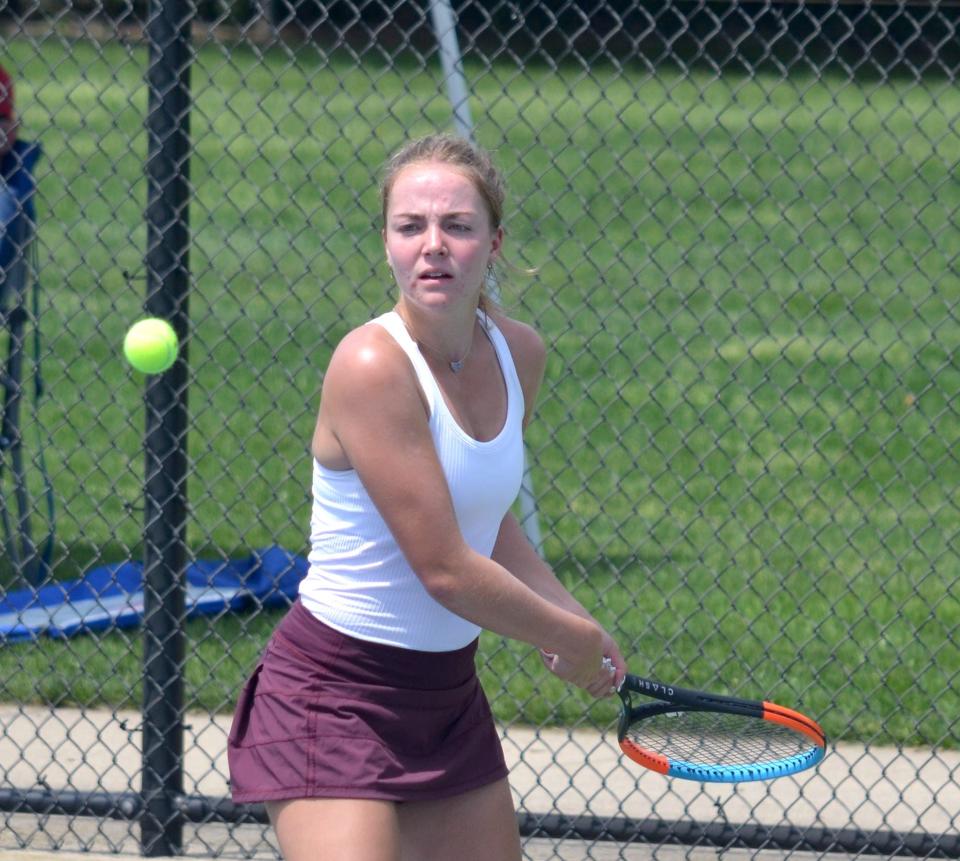 Holland Christian's Bria Lampen returns a shot during the OK Blue Conference finals on Friday at Holland Christian.