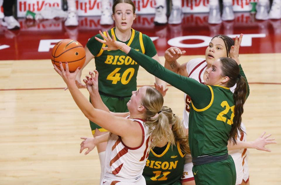 Iowa State's Hannah Belanger shoots against North Dakota State defenders during Sunday's game at Hilton Coliseum.