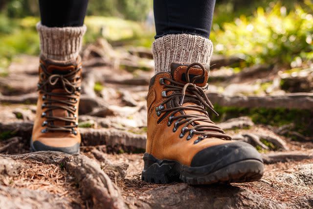 <p>Getty</p> Stock image of a person hiking on a trail