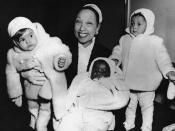 FILE- Actress Josephine Baker in her apartment at the Hotel Forresta near Stockholm, Sweden on Dec. 7, 1957, with three of her adopted children, Marianne, left, Koffi, center, and Brahim. France is inducting Josephine Baker – Missouri-born cabaret dancer, French Resistance fighter and civil rights leader – into its Pantheon, the first Black woman honored in the final resting place of France's most revered luminaries. (AP Photo, File)