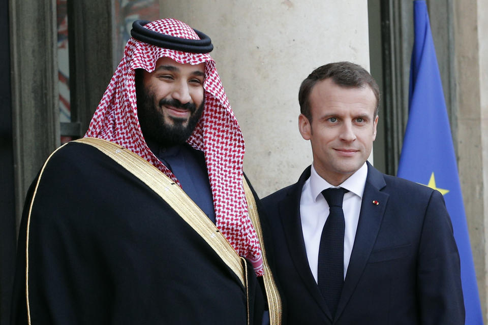 FILE - French President Emmanuel Macron, right, poses with Saudi Arabia Crown Prince Mohammed bin Salman before a meeting at the Elysee Palace in Paris, Tuesday, April 10, 2018. Macron meets with Prince Mohammed in Paris to bolster economic ties and strengthen cooperation on security and defense between the two countries. Still reeling from the recent submarine deal rapture by Western allies, French President Emmanuel Macron is visiting the energy-rich Arab countries of the Persian Gulf on Friday Dec. 3, 2021, with an aim to close a lucrative arms deal and strengthen France's leadership role in renewed international efforts to revive Iran's cratered nuclear deal with world powers. (AP Photo/Christophe Ena, File)
