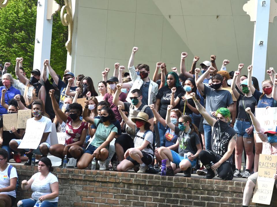 After a silent march in downtown Staunton Tuesday, June 2, protesters gather on the bandstand in Gypsy Hill Park.