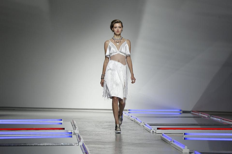 The Rodarte Spring 2014 collection is modeled during Fashion Week in New York, Tuesday, Sept. 10, 2013. (AP Photo/Seth Wenig)