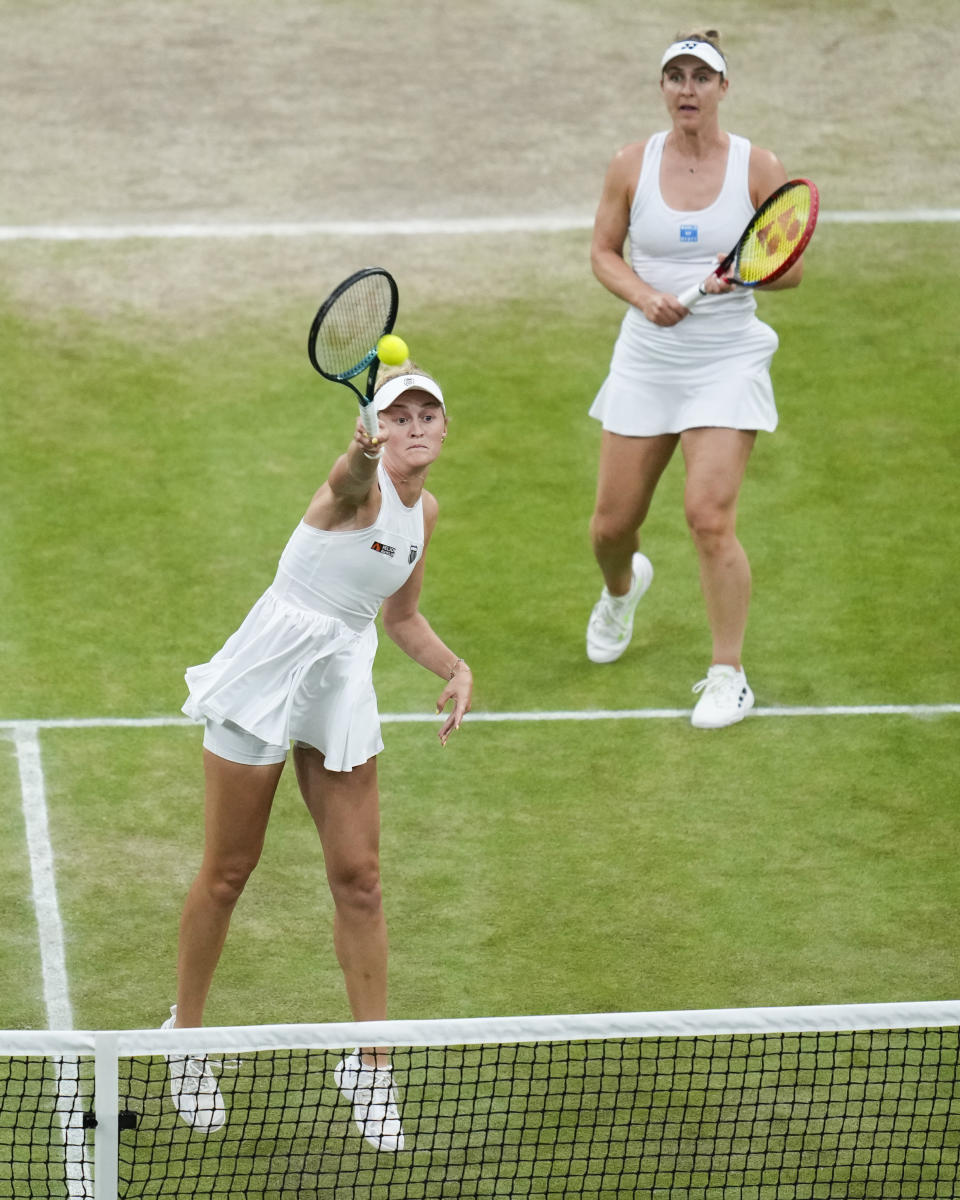 Gabriela Dabrowski of Canada and Erin Routliffe, left, of New Zealand in action against Katerina Siniakova of the Czech Republic and Taylor Townsend of the United States in the women's doubles final at the Wimbledon tennis championships in London, Saturday, July 13, 2024. (AP Photo/Kirsty Wigglesworth)