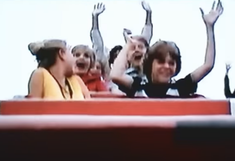 the family in the rollercoaster cart