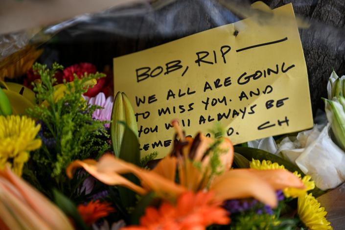 A note with flowers at a memorial for Bob Lee, which reads: &quot;Bob, RIP &#x002014; We all are going to miss you, and you will always be remembered. CH&quot;