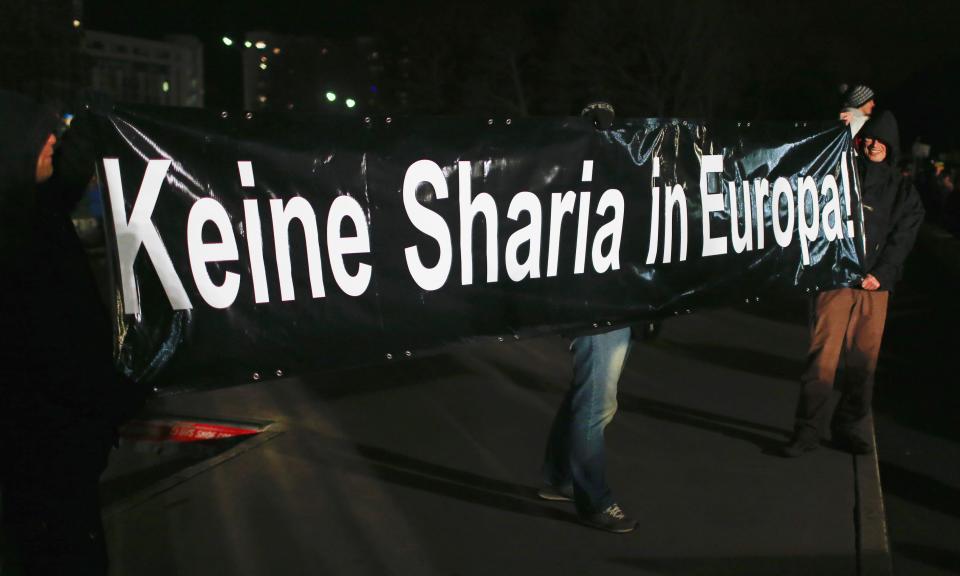 Participants hold a banner during a demonstration called by anti-immigration group PEGIDA in Dresden