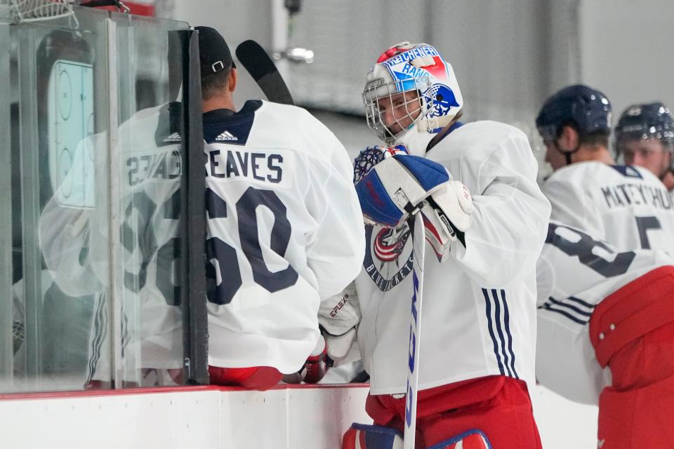 Jul. 13, 2022; Lewis Center, OH USA;  Columbus Blue Jackets goaltender Pavel Cajan (30) talks to goaltender Jet Greaves (60) during development camp at the OhioHealth Chiller North in Lewis Center on July 13, 2022. Mandatory Credit: Adam Cairns-The Columbus Dispatch