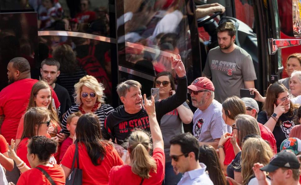 NC State’s women’s head basketball coach Wes Moore is greeted by fans on Tuesday, April 2, 2024 while boarding a bus outside Reynolds Coliseum bound for the Final Four game on Friday. Travis Long/tlong@newsobserver.com
