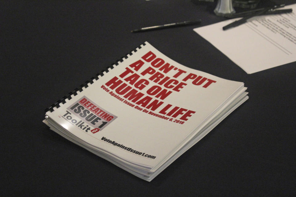 In this July 26, 2018 photo, an information booklet about a "tort reform" measure appearing on Arkansas' ballot sits on a table at a breakfast meeting of pastors in Little Rock, Arkansas. The Family Council Action Committee, a conservative Christian group, is rallying churches against the ballot measure to impose new limits on lawsuit damages. (AP Photo/Andrew Demillo)