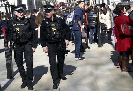 Armed police patrol following the attack in Westminster earlier in the week, in central London, Britain March 26, 2017. REUTERS/Neil Hall