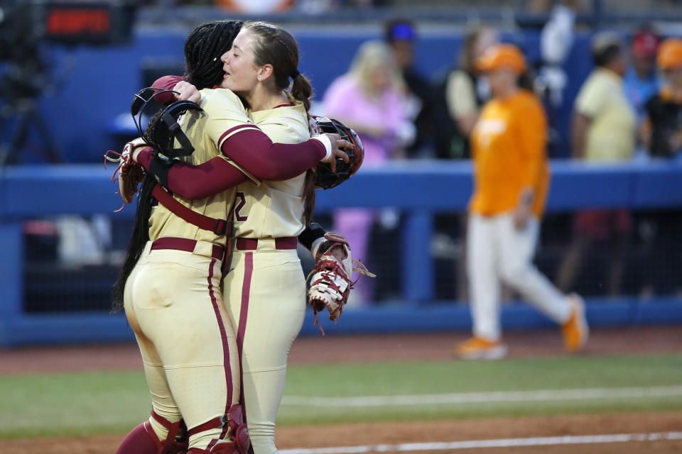 Florida State catcher Michaela Edenfield, left, and pitcher Kathryn Sandercock celebrate after a win over Tennessee in an NCAA softball Women's College World Series game Monday, June 5, 2023, in Oklahoma City. (AP Photo/Nate Billings)