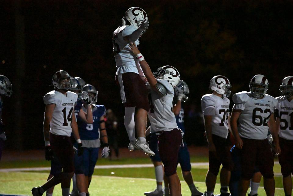 Nate Falconer (25) celebrates a touchdown for the Northbridge Rams.