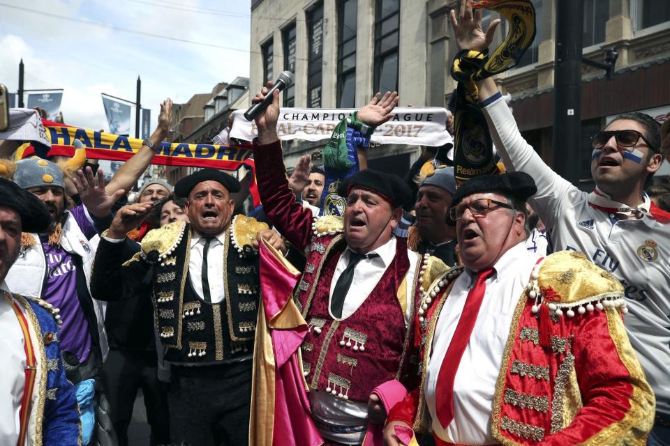 <p>Real Madrid fans gesture, ahead of the Champions League final match between Juventus and Real Madrid in Cardiff, Wales </p>