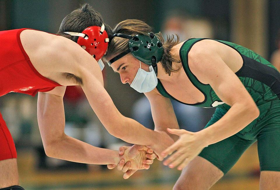 In a 138-pound match, Owen Badgio of Marshfield, in green, wrestled Jack Kelleher of Hingham in May 2021. Greg Derr/The Patriot Ledger