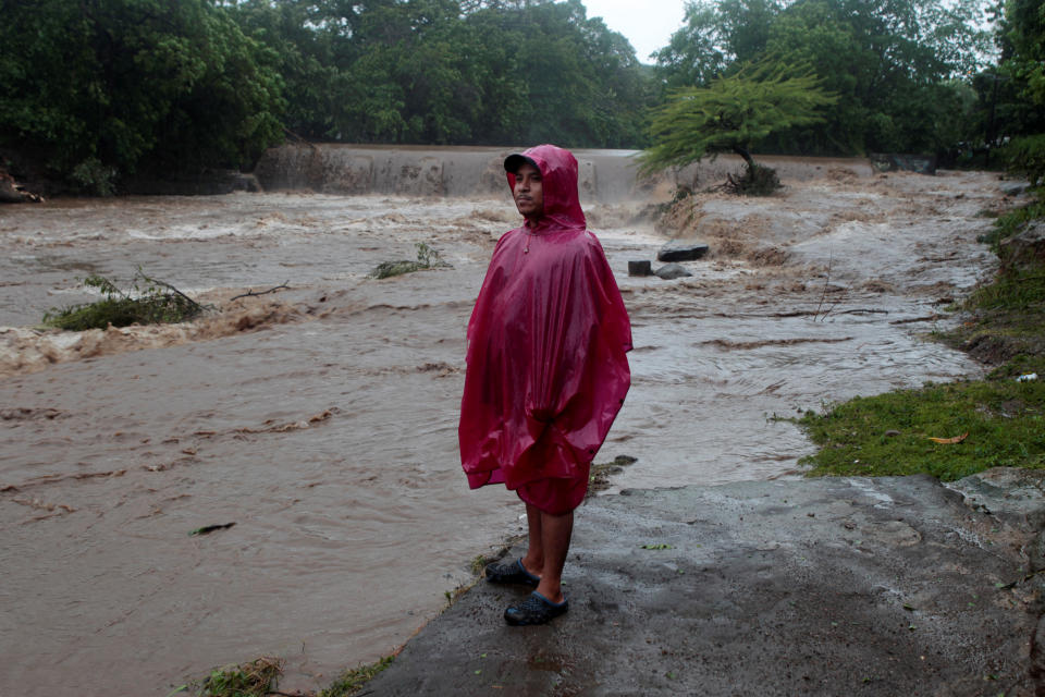 <p>A resident stands on the shore of the Masachapa river, flooded by heavy rains by Tropical Storm Nate in the outskirts of Managua, Nicaragua, Oct. 5, 2017. (Photo: Oswaldo Rivas/Reuters) </p>