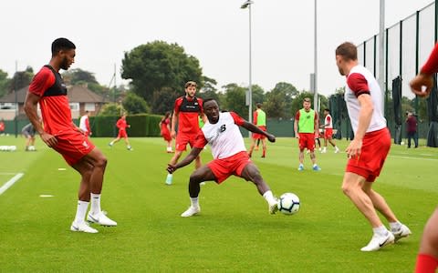 Naby Keita (centre) training with Liverpool at Melwood - Credit: getty images