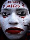 A student gets his face painted with a message to fight against AIDS during a face painting competition in Ahmadabad, India, Friday, Jan. 29, 2010. Roughly 2.5 million Indians are HIV-positive. (AP Photo/Ajit Solanki)