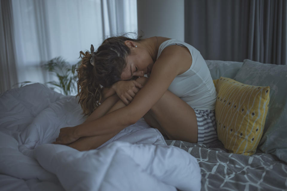 Woman waking up after a bad dream. (Getty Images)