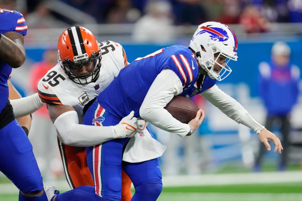 Cleveland Browns defensive end Myles Garrett (95) sacks Buffalo Bills quarterback Josh Allen during the first half of an NFL football game, Sunday, Nov. 20, 2022, in Detroit. (AP Photo/Paul Sancya)