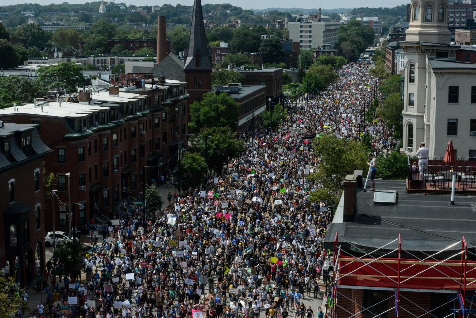 A large crowd of people march towards the Boston Commons to protest the Free Speech Rally, Aug. 19, 2017.