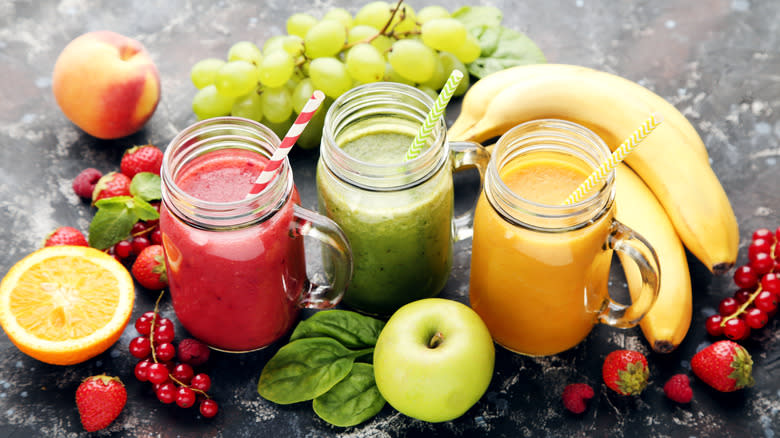 A group of smoothies and fruit