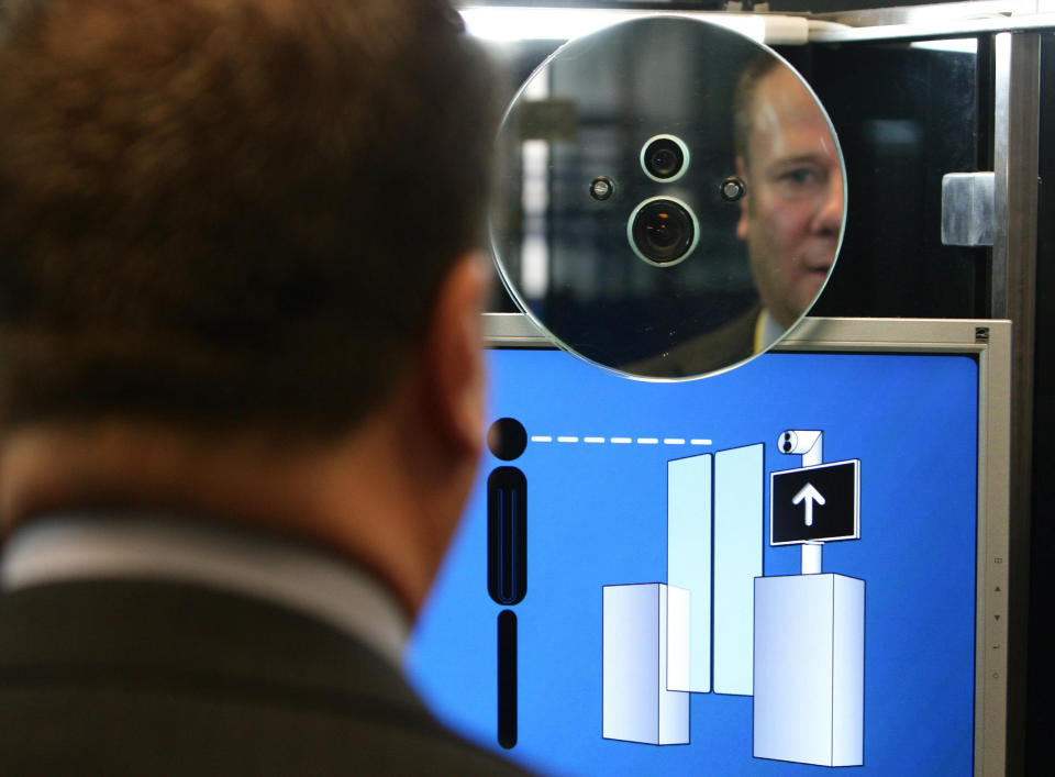 A member of the UK Border Agency (name not given) has his face scanned on the new facial recognition system at Manchester Airport.   (Photo by Dave Thompson - PA Images/PA Images via Getty Images)