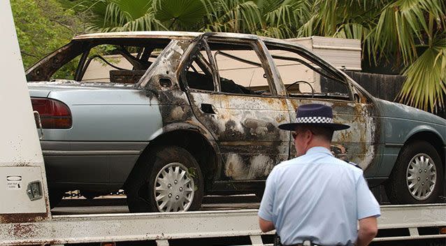 A police truck removes a burnt getaway car that was found in a lane way used by gunmen to shoot leading Melbourne underworld figure Graham Kinniburgh. Photo: AAP