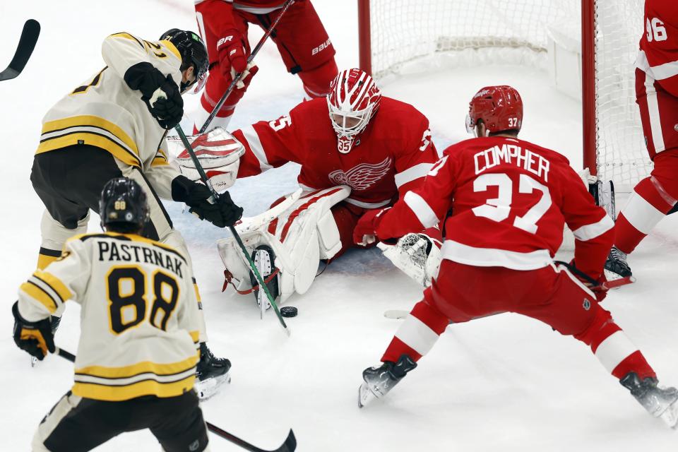 Detroit Red Wings' Ville Husso (35) blocks a shot by Boston Bruins' James van Riemsdyk (21) during the first period of an NHL hockey game Saturday, Oct. 28, 2023, in Boston. (AP Photo/Michael Dwyer)