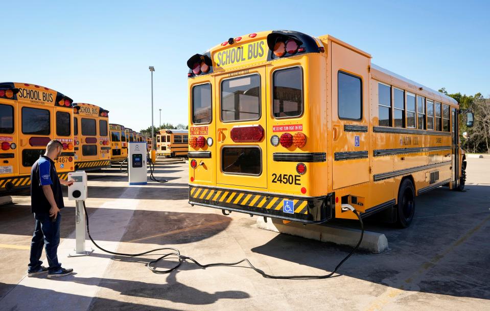 Shop foreman Daniel Webb checks the charge level of an electric school bus at the Austin Independent School District Southeast Bus Terminal on Monday January 29, 2024.