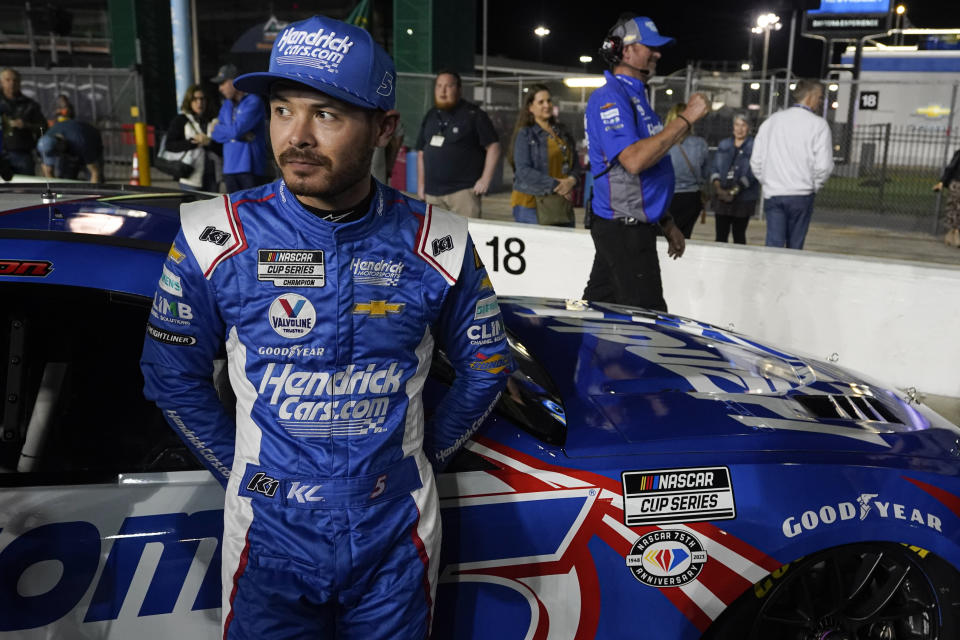 FILE - Kyle Larson stands by his car on pit road after qualifying for the NASCAR Daytona 500 auto race at Daytona International Speedway, Wednesday, Feb. 15, 2023, in Daytona Beach, Fla. No one needs to remind Kyle Larson about his record at Daytona International Speedway. It's the only NASCAR venue at which he doesn’t even have a top-five finish. (AP Photo/John Raoux, File)