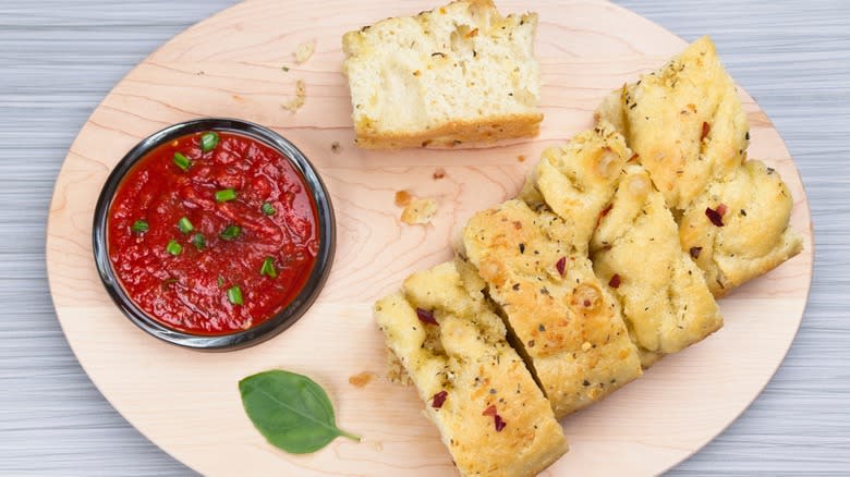 sliced focaccia with tomato dip