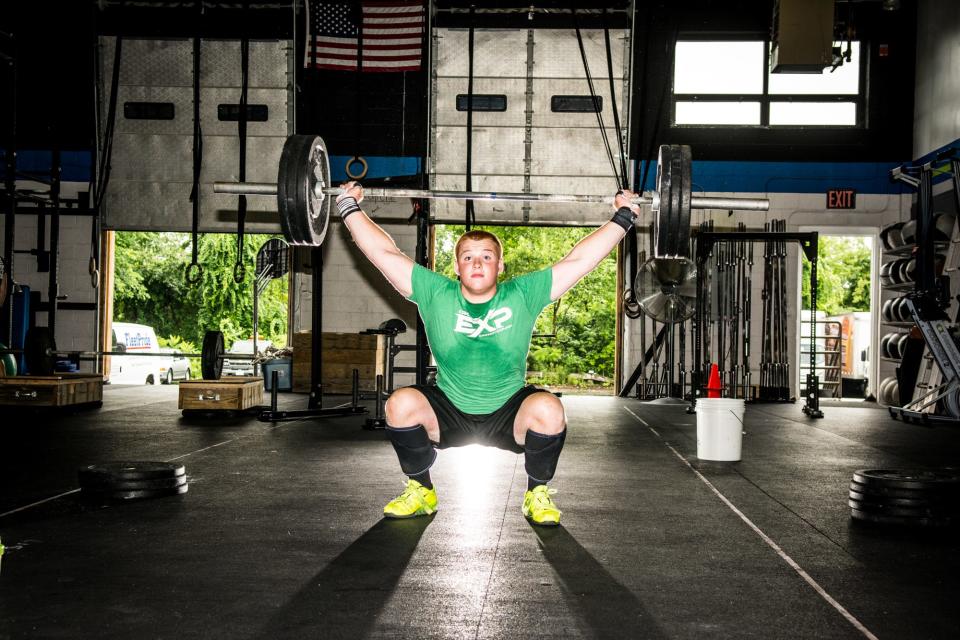 St. John's High football captain Sam Norton works out at Crossfit EXP in Leominster in 2014.