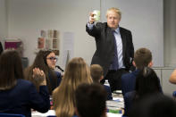 Britain's Prime Minister Boris Johnson visits Ruislip High School in his constituency of Uxbridge, west London, Monday Sept. 28, 2020. Lawmakers and scientists have criticized Johnson's Conservative government for problems with the national test-and-trace program that was supposed to help control the spread of the disease and reduce the need for limits on social interactions. (Stefan Rouseau/PA via AP)