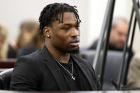 Former Virginia Tech football player Jordan Brunson testifies during Isimemen David Etute's trial in Montgomery County Circuit Court in Christiansburg, Va., Friday May 27 2022. Etute is accused of fatally beating Jerry Smith, 40 in May 2021, a man he met on an online dating site and had initially believed to be a woman. (Matt Gentry/The Roanoke Times via AP)