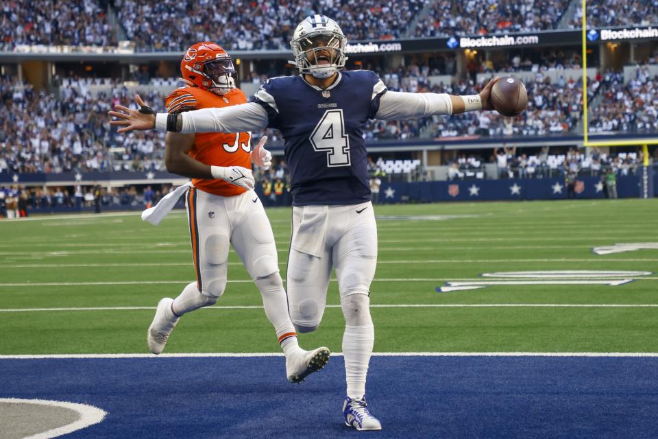 Dallas Cowboys' Dak Prescott runs for a touchdown during the first half of an NFL football game against the Chicago Bears Sunday, Oct. 30, 2022, in Arlington, Texas. (AP Photo/Michael Ainsworth)