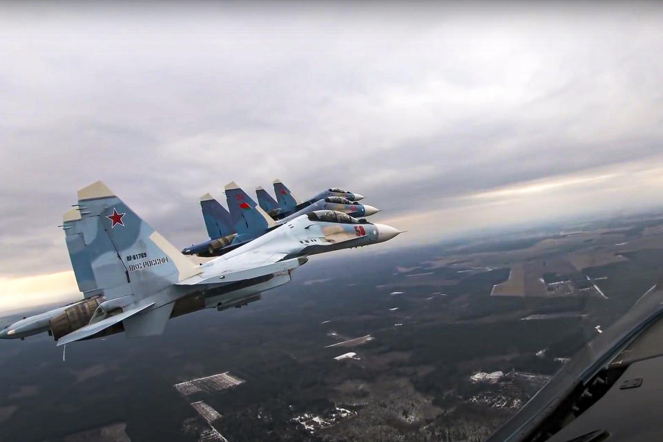 FILE - In this photo taken from video provided by the Russian Defense Ministry Press Service on Thursday, Feb. 17, 2022, Su-30 fighters of the Russian and Belarusian air forces fly in a joint mission during military drills in Belarus. Belarus President Alexander Lukashenko has welcomed thousands of Russian troops to his country, allowed the Kremlin to use it to launch the invasion of Ukraine on Feb. 24, 2022, and offered to station some of Moscow’s tactical nuclear weapons there. But he has avoided having Belarus take part directly in the fighting – for now. (Russian Defense Ministry Press Service via AP, File)
