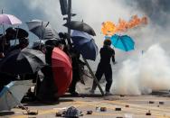 Protesters clash with police outside Hong Kong Polytechnic University (PolyU) in Hong Kong