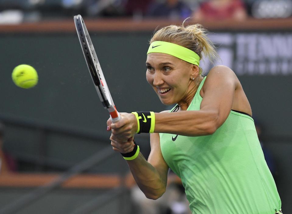 Elena Vesnina, of Russia, returns a shot to Venus Williams at the BNP Paribas Open tennis tournament, Thursday, March 16, 2017, in Indian Wells, Calif. (AP Photo/Mark J. Terrill)