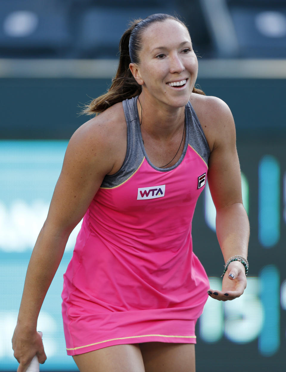 Jelena Jankovic, of Serbia, smiles during a match against Ajla Tomljanovic, of Croatia, at the Family Circle Cup tennis tournament in Charleston, S.C., Thursday, April 3, 2014. (AP Photo/Mic Smith)