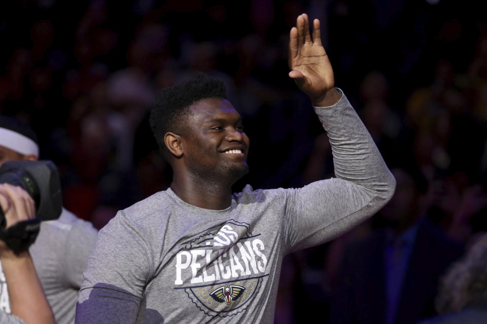 New Orleans Pelicans forward Zion Williamson (1) enters the court during introductions before the start of an NBA basketball game in New Orleans, Sunday, March 1, 2020. (AP Photo/Rusty Costanza)