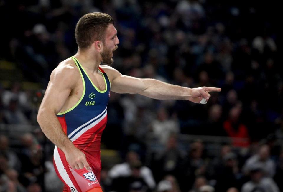 Zain Retherford points to teammate Nick Lee after they both won their semifinal bouts during the U.S. Olympic Team Trials at the Bryce Jordan Center on Friday, April 19, 2024.