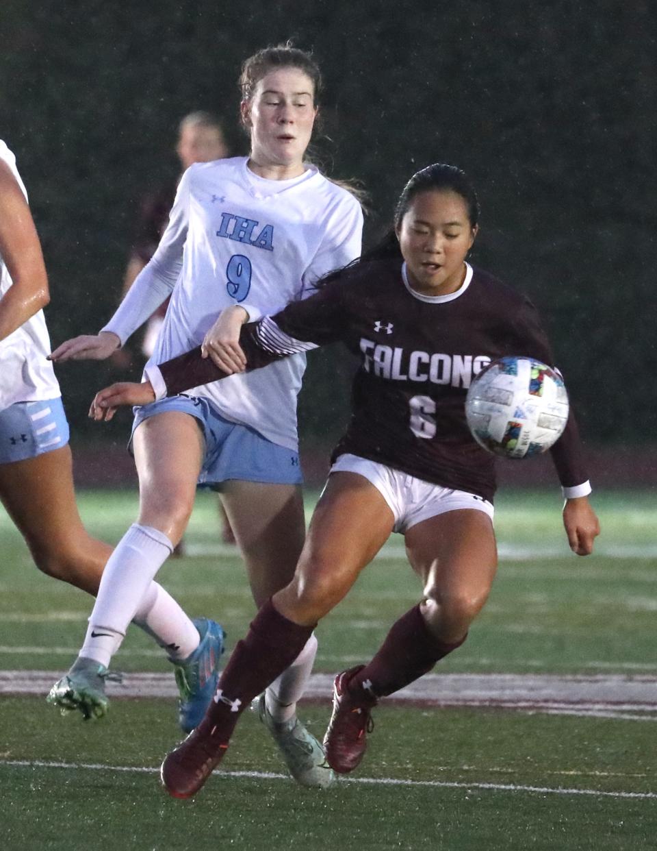 Albertus Magnus' Gabby Chan plays the ball in front of Immaculate Heart Academy's Maddy Hayes during their game at Albertus Magnus Oct. 5, 2022. IMA won 1-0 in 2OT.