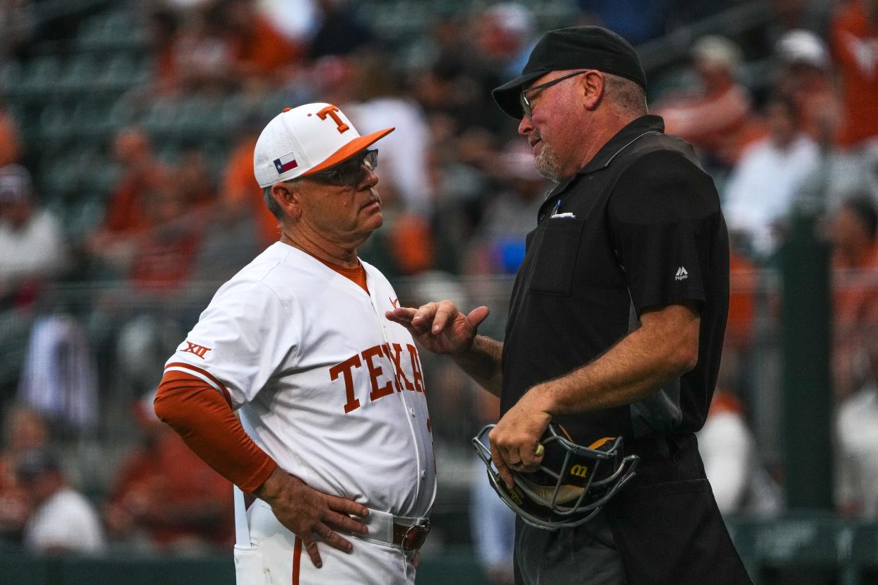 Texas baseball coach David Pierce disputes a call with the umpire during Friday's 7-5 win over Oklahoma State. The Horns took two games in the series and improved to 30-19 overall and 15-9 in Big 12 play entering a road series against Central Florida.