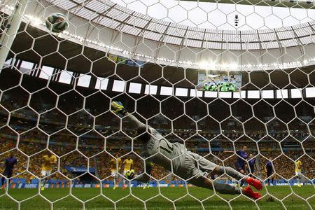 Robin van Persie of the Netherlands (4th R) scores a goal from a penalty kick past Brazil's goalkeeper Julio Cesar (12) during their 2014 World Cup third-place playoff at the Brasilia national stadium in Brasilia July 12, 2014. REUTERS/Dominic Ebenbichler